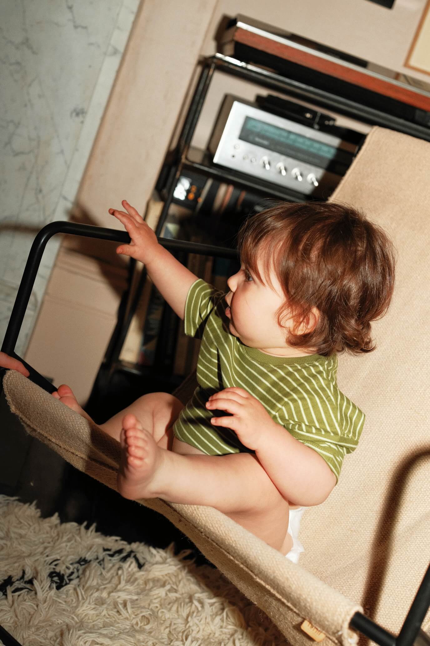 baby reaching for something